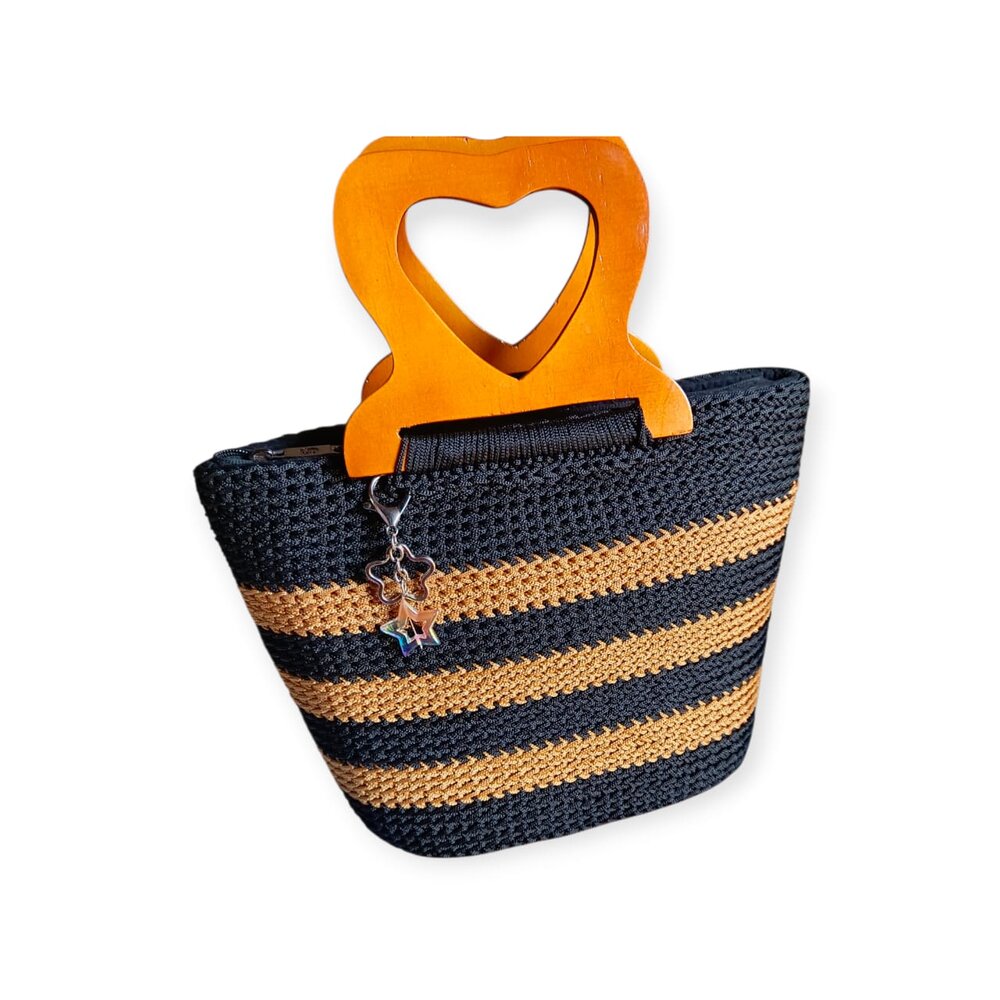 Black and tan crochet bag with wooden heart handle