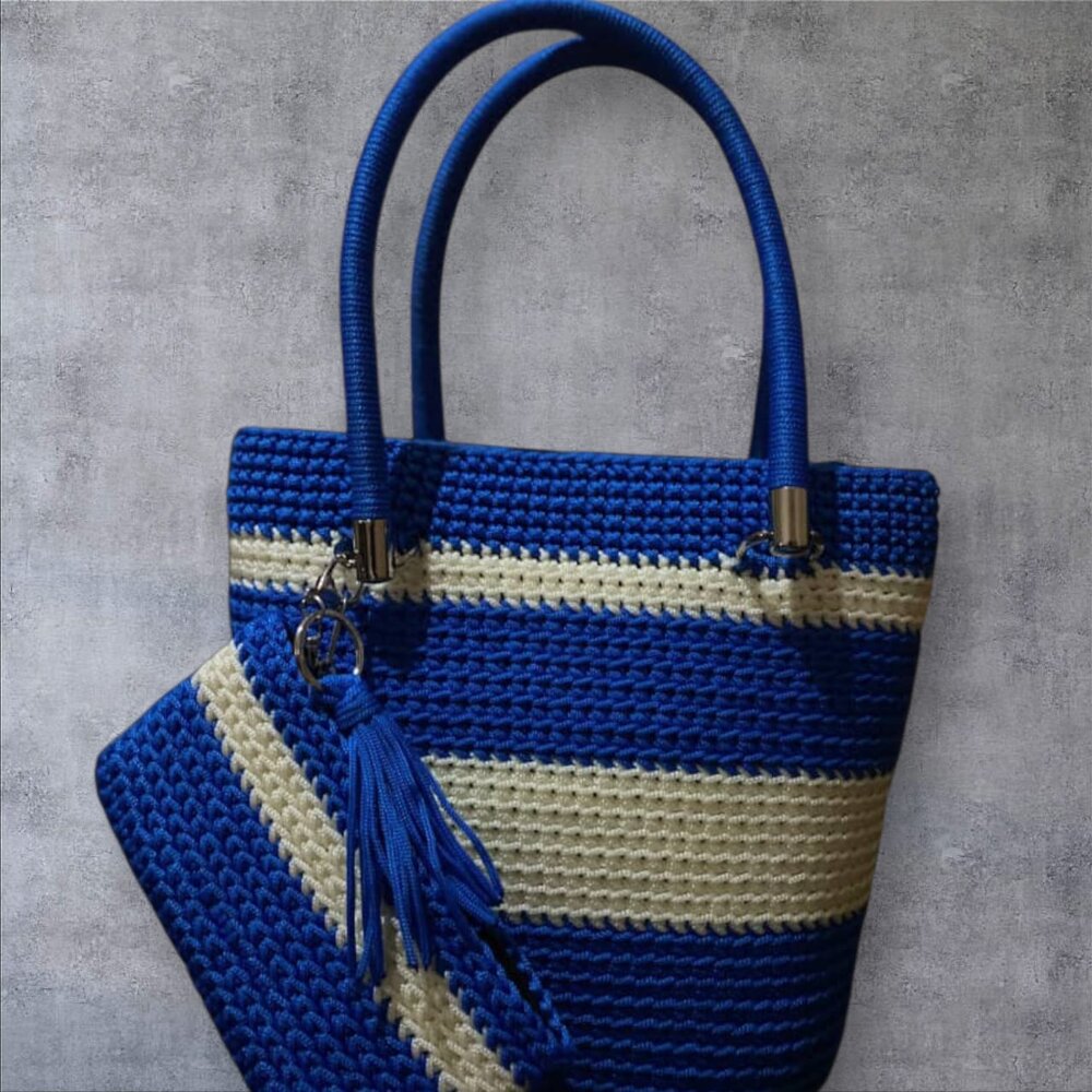 Royal blue and cream striped crochet tote with rope handles and tassel