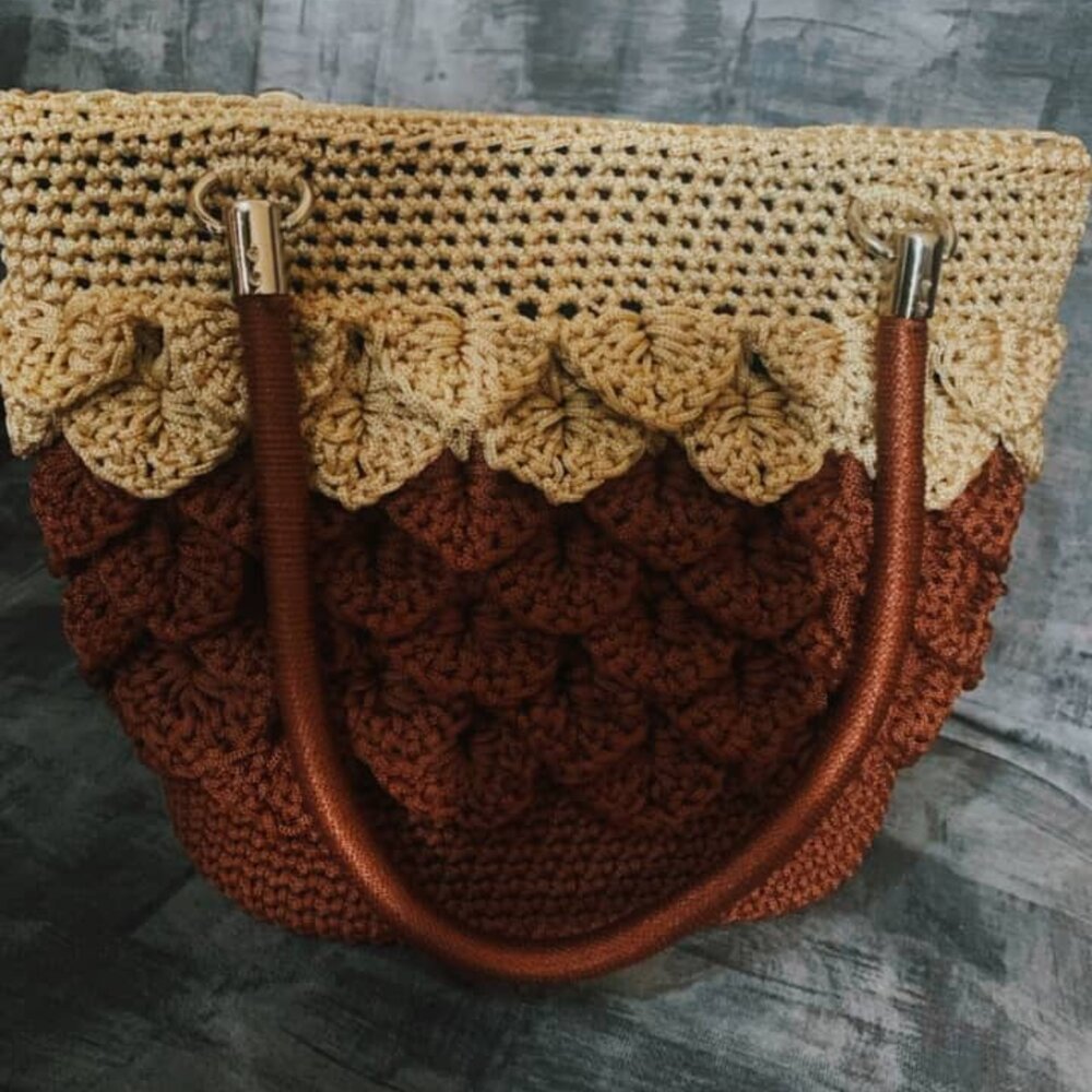 Deep blue textured crochet tote with metal monogram