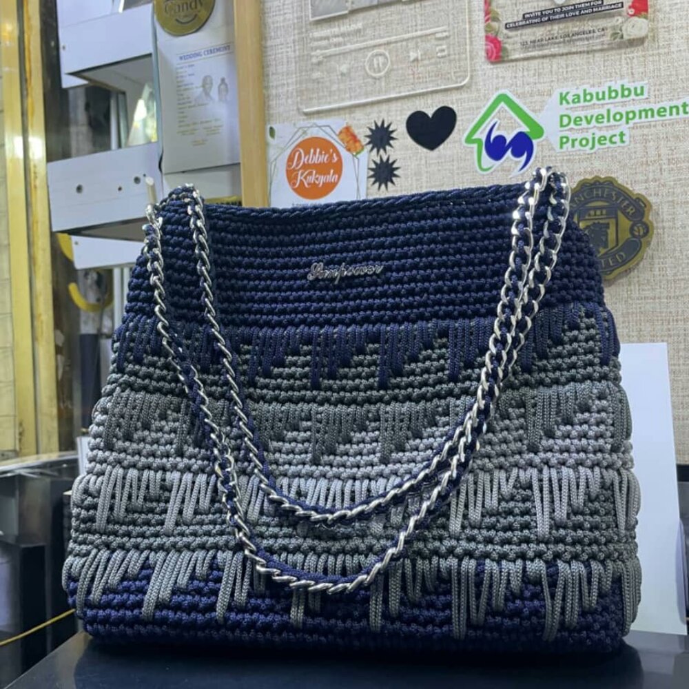 Black crochet rose-pattern handbag with gold chain handle